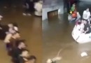 Voluntários dão as mãos e fazem corrente humana para resgatar pessoas em barco no RS